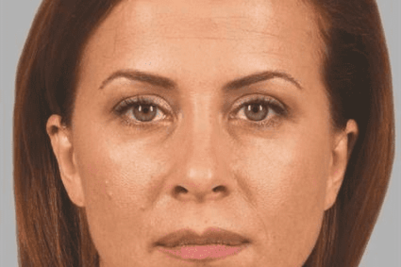 Close-up neutral expression woman with brown hair